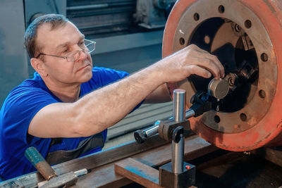 Close-up of man working at workshop