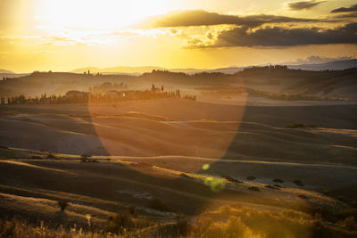 Scenic view of landscape against sky during sunset