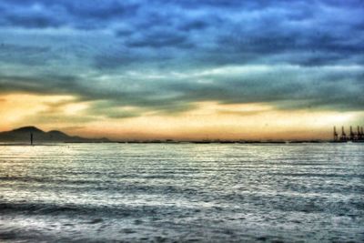 Scenic view of sea against dramatic sky