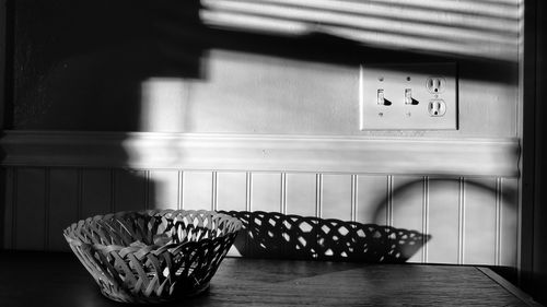 Close-up of clock on table at home