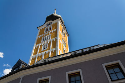 Low angle view of building against clear blue sky