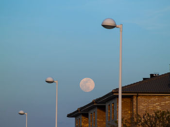 Low angle view of street light against clear sky