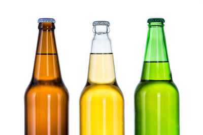 Close-up of glass bottle against white background