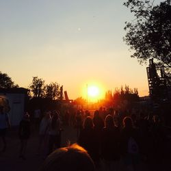 Silhouette of people at sunset