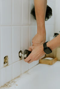 Low section of woman standing in bathroom