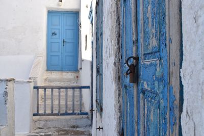 Close-up of padlock on blue door