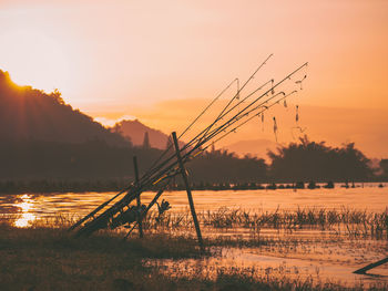 Scenic view of field against sky during sunset
