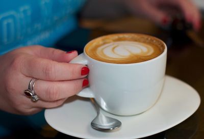 Cup of coffee on table at cafe