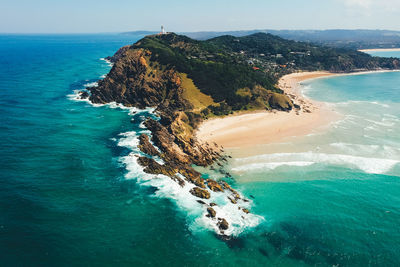 High angle view of rocks on beach against sky