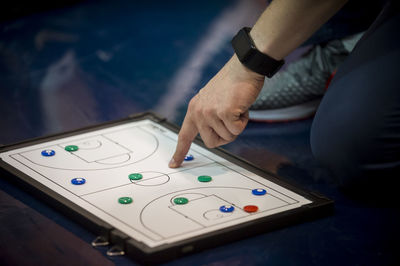 High angle view of man hand on table