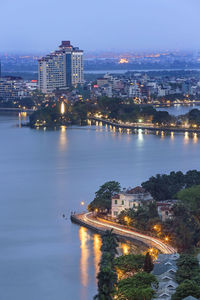 High angle view of city lit up at night