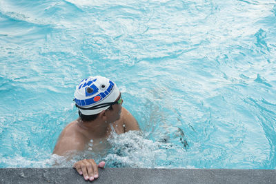 Man swimming in pool