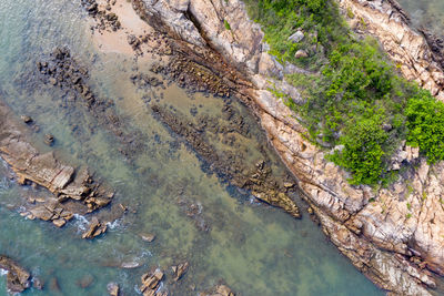 High angle view of water flowing through rocks