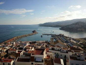 High angle view of harbor by sea against sky