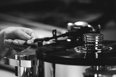 Cropped hand of person using turntable