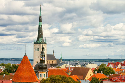 Panoramic view of buildings in city against sky