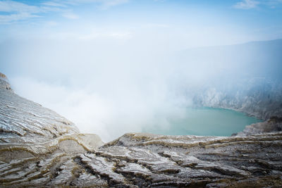 Scenic view of volcanic mountain against sky