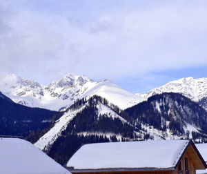 Snow covered mountains against sky