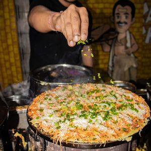 Midsection of man preparing food