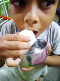 Portrait of boy drinking coffee