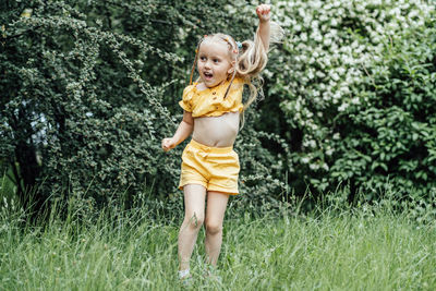 Summer activities and connecting with nature for kids. cute little girl with two ponytails runs