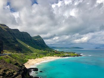 Scenic view of sea against cloudy sky