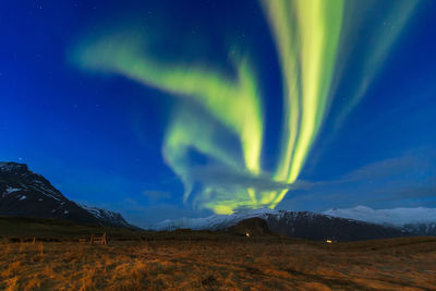 Scenic view of rainbow against sky at night