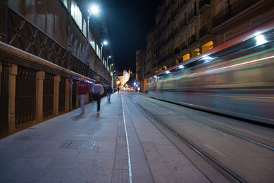 Blurred motion of tram on city street