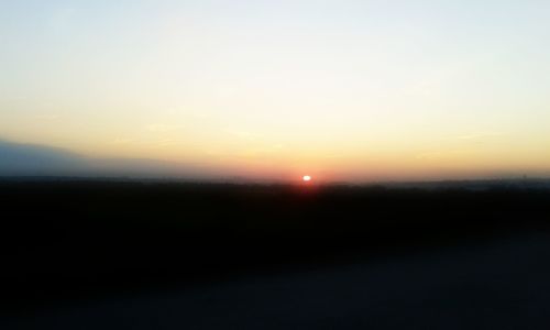 Scenic view of silhouette landscape against sky during sunset