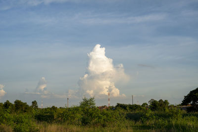 Panoramic view of smoke stacks against sky