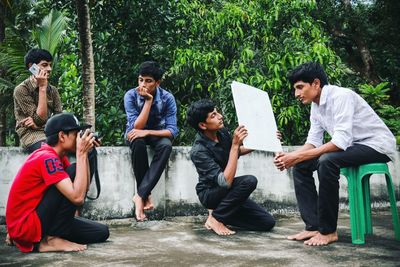 Friends sitting in park