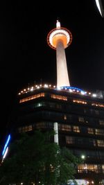 Low angle view of building lit up at night