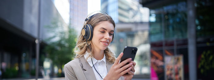 Young woman using phone