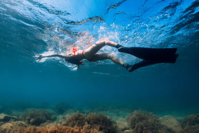 Woman swimming in sea