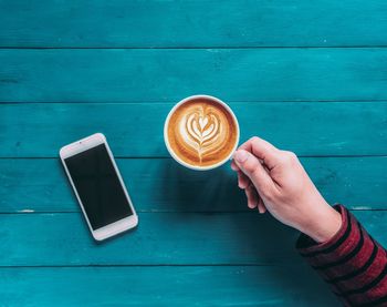 Directly above shot of coffee cup on table