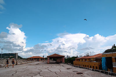 View of buildings against cloudy sky