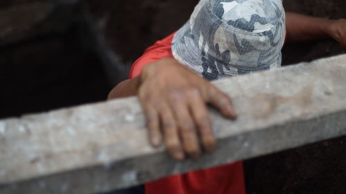 Close-up of man hand standing outdoors