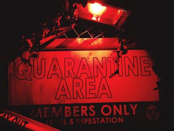 Illuminated neon light at night