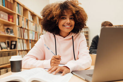 Portrait of smiling girl in library