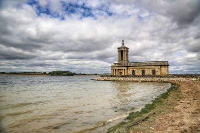View of historic building against cloudy sky
