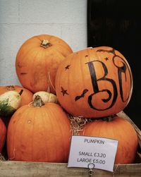 Close-up of pumpkin on wooden wall during halloween