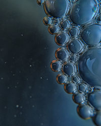 High angle view of water drops on metal