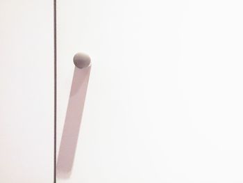 Close-up of pole against white background