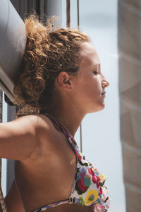 Portrait of young woman looking away