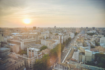 High angle view of buildings against sky during sunset