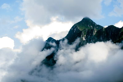 Low angle view of majestic mountains against sky