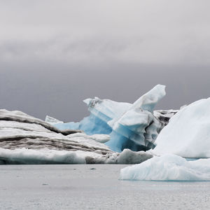 Scenic view of frozen sea against sky