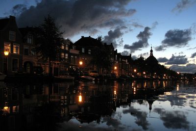 Reflection of illuminated buildings in water at night