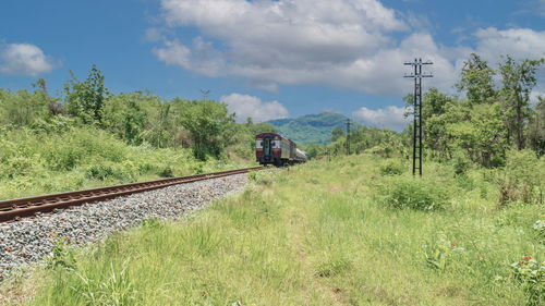 Train on railroad track against sky