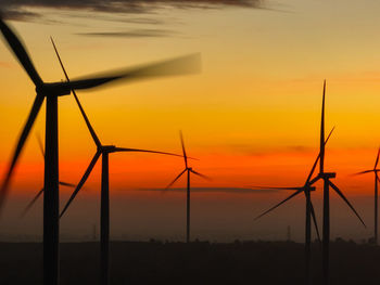 Wind farm landscape against sunset sky. wind energy. wind power. sustainable and renewable energy.